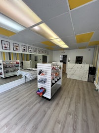 the interior of a store with yellow walls and wooden floors