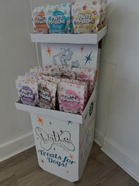 a display of treats on a table in front of a wall